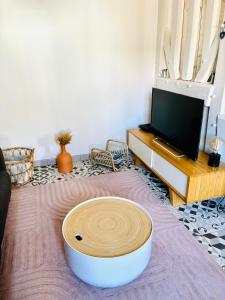 a living room with a large white bowl on the floor at La Petite Ardoise - Maison au calme pour 4 pers in Honfleur +27 photos