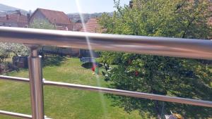 a view of a yard with a house at Apartmanii Gajić in Kuršumlija