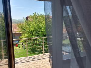 a view from a window of a balcony with a view at Apartmanii Gajić in Kuršumlija