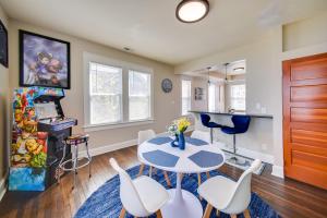 a kitchen and dining room with a table and chairs at Modern Portsmouth Apartment Walk to Norfolk Ferry in Portsmouth