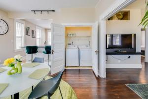 a kitchen and dining room with a table and chairs at Waterfront Portsmouth Apt half Mi to Dtwn and Ferry in Portsmouth