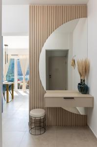 a living room with a mirror and a stool at Luxury Apartments Blue Moon - New Apartments in Slano +37 photos