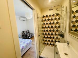 a bathroom with a shower and a sink at Villa Verde Piran, Authentic Mediterranean Stay in Piran