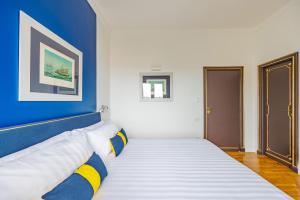 Postel nebo postele na pokoji v ubytování Terrazza Monteroduni 16