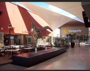 a restaurant with a statue of a bird in a mall at Departamento Ale La Paz México Baja California Sur in La Paz