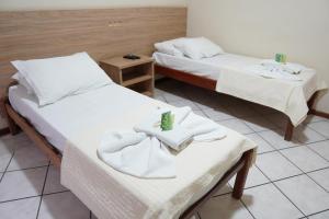 Ein Bett oder Betten in einem Zimmer der Unterkunft Castelo Hotel