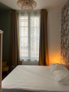 Katil atau katil-katil dalam bilik di le Limo: logement cosy en hyper centre