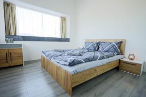 Postel nebo postele na pokoji v ubytování Panorama Residence