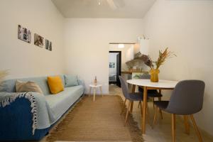 a living room with a couch and a table at Pieros Studio Tsimis in Paleokastritsa