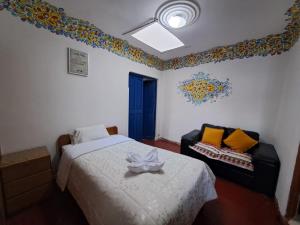 Un pat sau paturi într-o cameră la CUSCO DEPARTAMENTOS