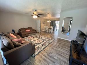 a living room with a couch and a table at Cozy Ocean Springs Get-away in Ocean Springs