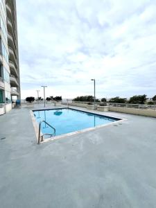 a swimming pool on the roof of a building at Just Beachy Get-away in Biloxi