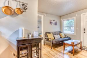 a living room with a couch and a table at Mt Air Unit 9 · Apt 9 at the base of Mt Hood in Mount Hood Village