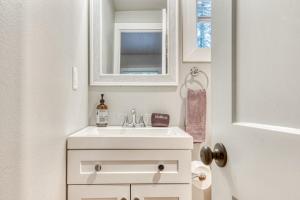 a white bathroom with a sink and a mirror at Mt Air Unit 9 · Apt 9 at the base of Mt Hood in Mount Hood Village