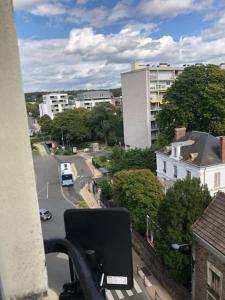 a view of a city street from a balcony at Appartement près de la Gare RIS ORANGIS in Ris-Orangis