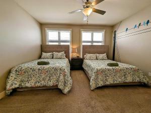 a bedroom with two beds and a ceiling fan at Pet Friendly! Themed, Great Location! Free Pkng! in Nashville