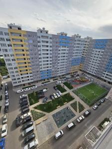 an aerial view of a parking lot with parked cars at LUXE APARTMENTS in Almaty