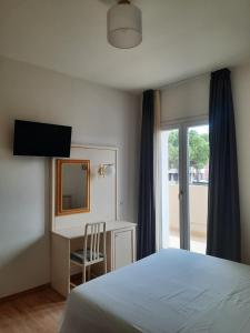 מיטה או מיטות בחדר ב-Hotel Schiller
