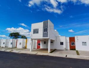 a white building on the side of a street at Modern Townhouse AC Wi-Fi full equipped Private in Santa Ana