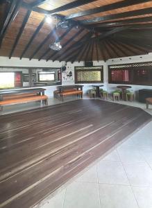 a bowling alley with benches and a wooden floor at Villa Isabela in Calima