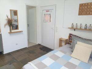 a bedroom with a bed with a checkered floor at Apartamento los 3B in Manabao