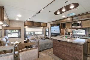 a kitchen and living room of an rv at Sunshine Key RV Resort & Marina in Big Pine Key