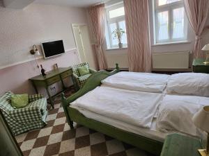 Voodi või voodid majutusasutuse Hotel & Restaurant zur Post toas