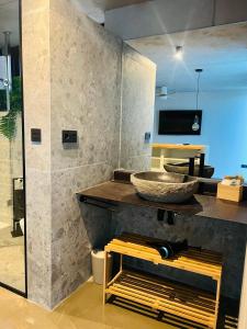 a bathroom with a sink and a bowl on a counter at Villa Salitre in Costa de Antigua