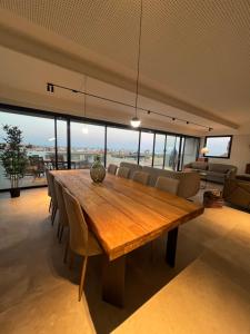 a dining room with a wooden table and chairs at Villa Salitre in Costa de Antigua