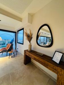 a room with a mirror and a table at Villa Salitre in Costa de Antigua +29 photos