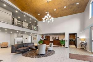 a living room with a couch and a table at Comfort Inn & Suites Springfield I-55 in Springfield