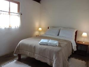 Cama ou camas em um quarto em Chalé na Montanha