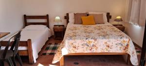 Cama ou camas em um quarto em Chalé na Montanha