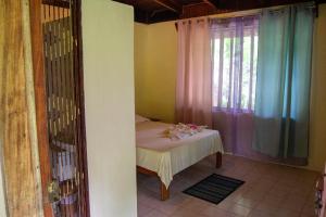 Ένα ή περισσότερα κρεβάτια σε δωμάτιο στο Ventanas Rio