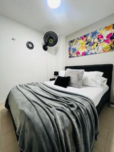 Una cama o camas en una habitación de Apartaestudio Encanto Pacífico