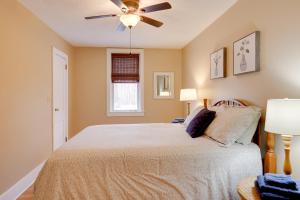 a bedroom with a bed with a ceiling fan at Finger Lakes Retreat 3 Mi to the Water! in Himrod