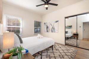 a bedroom with a bed and a ceiling fan at Exquisite 1BR Suite ahead of Cedar-Sinai Hospital in Los Angeles