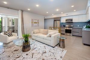 a living room with a couch and a table at Luxurious 2BR Condo in K-town w/ Private Balcony! in Los Angeles