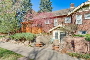 a brick house with a garden in front of it at Pet-Friendly Denver Home 2 Blocks to City Park! in Denver