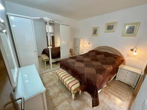 a bedroom with a large bed and a mirror at Primavera in Costa Del Silencio +53 photos