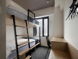 Postel nebo postele na pokoji v ubytování TUNE STAY KYOTO