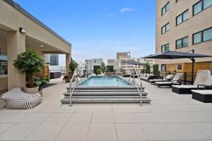 a swimming pool on the roof of a building at The Eleanor New Orleans in New Orleans