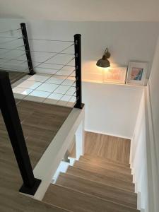 a staircase with a glass railing in a house at La Casita in Miami +9 photos
