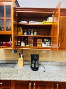 a coffee maker on a counter in a kitchen at Casa Mágica in Flores