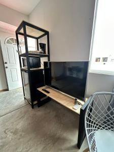 a room with a mirror and a wooden table at Bugambilias 203 Oaxaca in Oaxaca City +14 photos