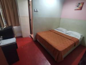 Postel nebo postele na pokoji v ubytování HOTEL BINTANG