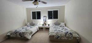 Ένα ή περισσότερα κρεβάτια σε δωμάτιο στο 50 scarborough golf club rd