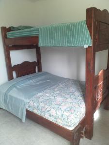 a bedroom with a bunk bed with a mattress and a mattress at Apartamento equipado frente de la bahía de pampatar in Pampatar