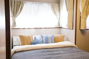 Katil atau katil-katil dalam bilik di -Takaya house- Minamirokugou close Haneda AP