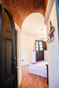 a bedroom with a bed and an open door at Finca Ana Isabel 